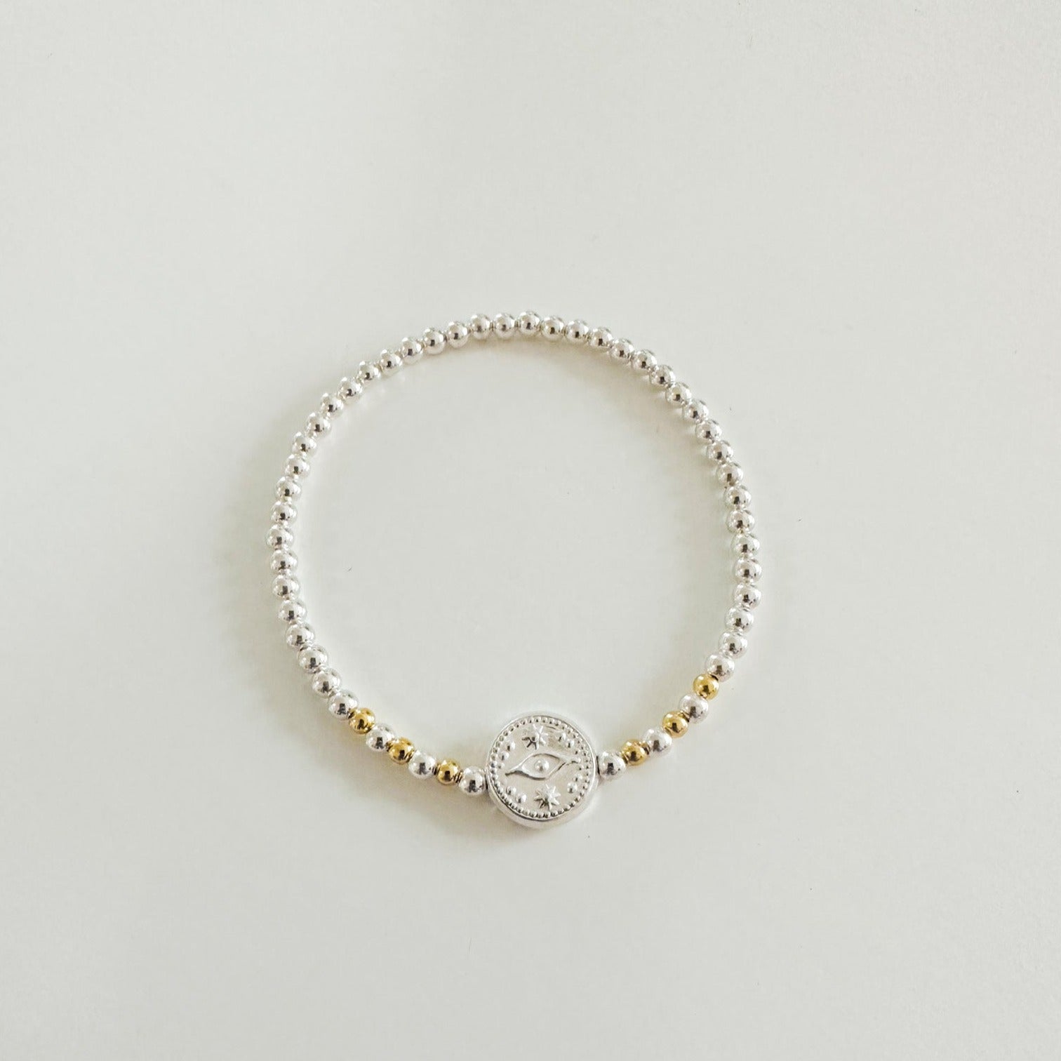 Amulet bracelet in Sterling Silver with gold beads and evil eye charm