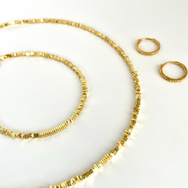 The Nix collection in Gold. Earrings, Necklace and bracelet